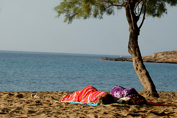 Image showing SLEEPING ON THE BEACH