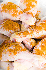 Image showing  spiced chicken legs on the foil 