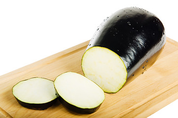 Image showing sliced Aubergine in kitchen Board isolated on white