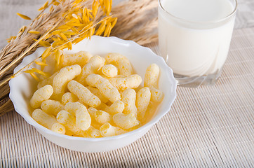 Image showing Breakfast. A glass of milk and corn flakes 