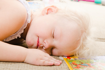 Image showing little girl fell asleep after playing 