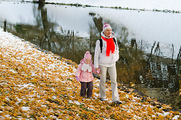 Image showing grandmother with the grand daughter in autumn park