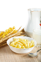 Image showing Breakfast. A glass of milk and corn flakes 