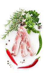 Image showing Raw bacon ribs with rosemary