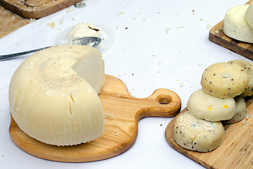 Image showing cut round ecologic goat milk cheese cut board 