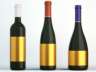 Image showing Three bottles for wine with blank golden labels
