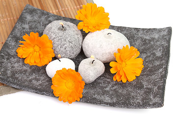 Image showing candles and massage stones in a calm zen spa