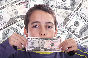 Image showing boy with dolar bills, business studio photo