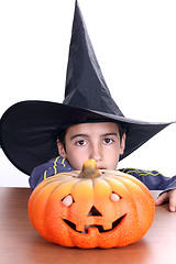 Image showing big pumpkin with black witch wizard halloween (focus on the wiza