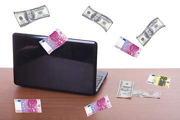 Image showing money flying and pouring out from a notebook computer