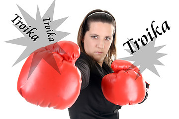 Image showing Portrait of a young businesswoman wearing boxing gloves