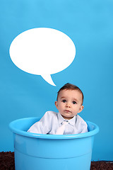 Image showing baby on a blue bucket, studio shoot