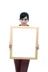 Image showing Young woman holding blank board