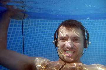 Image showing man underwater listen music with head-phones