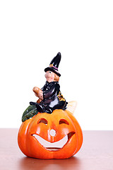 Image showing big pumpkin with black witch wizard halloween