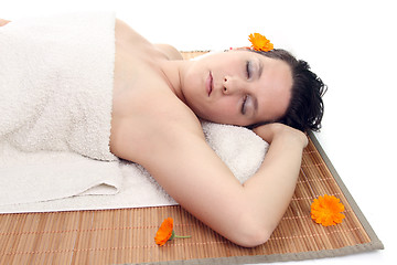 Image showing attractive woman with hot stones treatment at a spa