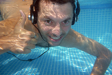 Image showing man underwater listen music with head-phones