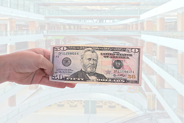 Image showing hand holding a dollar bill, business studio photo