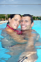 Image showing Loving swimmingpool smiling couple