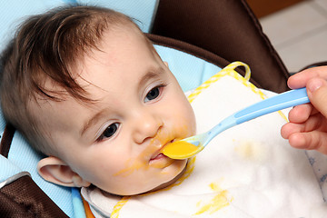 Image showing beautiful child eating soup, food child photo