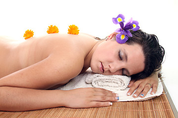Image showing attractive woman with hot stones treatment at a spa
