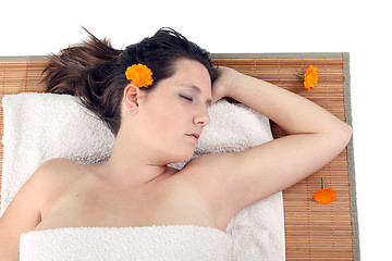 Image showing attractive woman with hot stones treatment at a spa