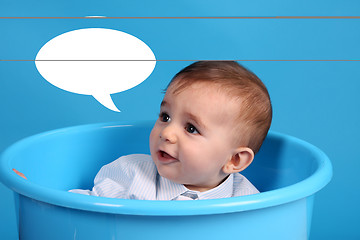 Image showing baby on a blue bucket, studio shoot, baby bubble talk