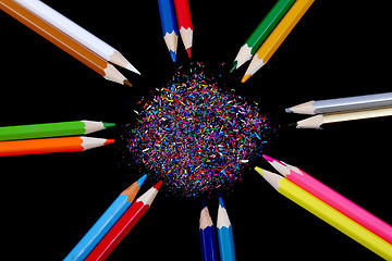 Image showing Assortment of coloured pencils with shadow on white/back backgro