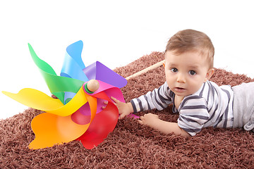 Image showing beautiful and happy baby with wind mill