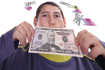 Image showing boy with dolares and euros, business studio photo