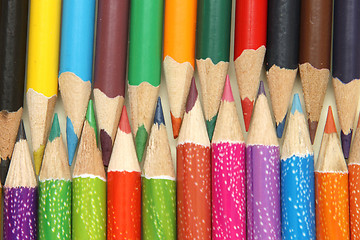 Image showing Assortment of coloured pencils with shadow on white background
