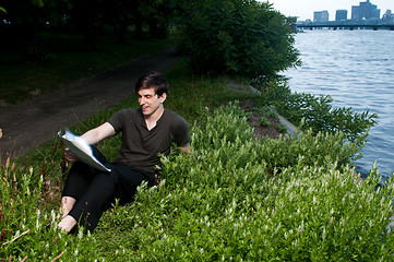 Image showing Man reading papers