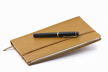 Image showing Leather notebook and pen isolated 