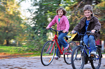 Image showing Happy children riding bikes