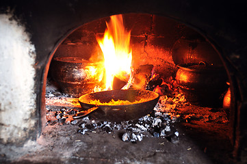 Image showing cooking in an old fireplace