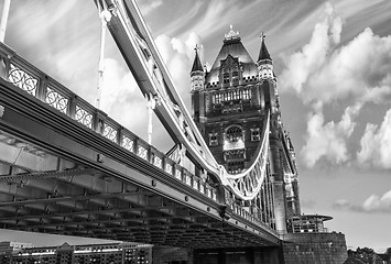 Image showing Famous Tower Bridge at sunset with clouds, seen from Tower of Lo