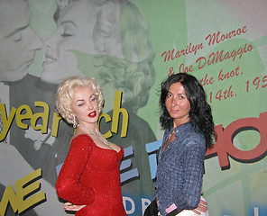 Image showing Girl Poses alongside Marylin Monroe inside Wax Museum in NYC