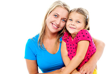 Image showing Adorable mom and daughter posing together