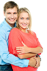 Image showing Happy man embracing his wife from behind