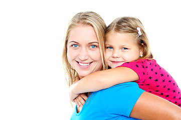 Image showing Daughter enjoying piggy ride. Playful mother