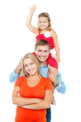 Image showing Happy family of three members standing in embrace