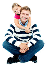 Image showing Daughter holding her father from behind