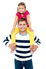 Image showing Fun loving kid sitting on her father's shoulders