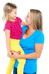 Image showing Gorgeous mother holding her beautiful daughter in arms