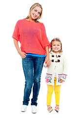 Image showing Mum and daughter posing in trendy outfits