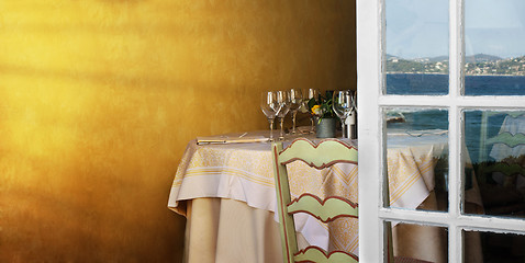 Image showing Arranged table in a restaurant and open window