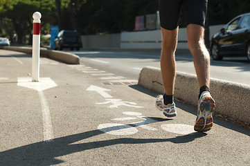 Image showing Human feets in sportshoes running 