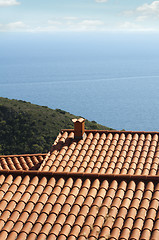 Image showing Tile roof of the house overlooking the sea