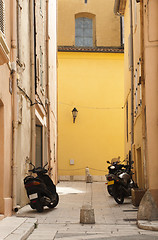 Image showing Scooters parked at the old buildings.