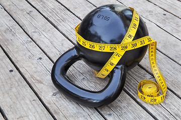 Image showing kettlebell and measuring tape